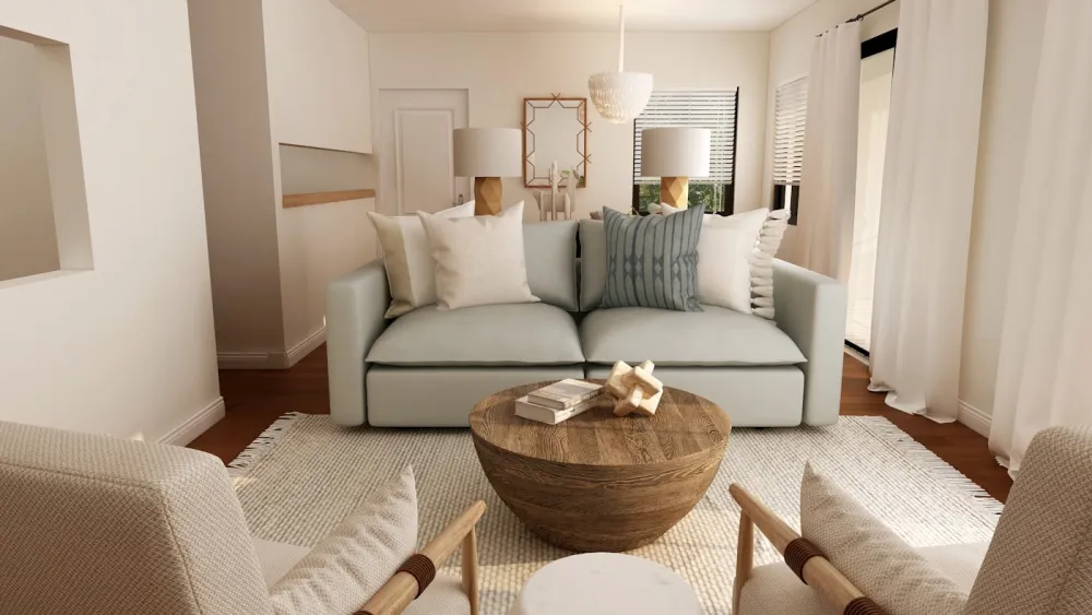 Pale linen sofa with a round wood table