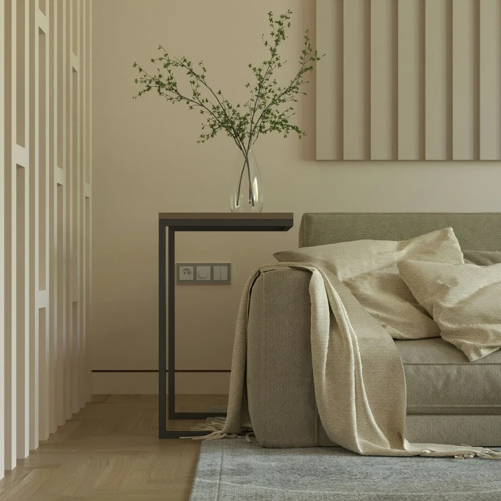 Linen bed against a fluted plaster wall with a sculptural vase